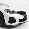 Front Lip splitter for BMW Series 3 G20 1 Close-up of a white car's front grille with a black grille and visible branding on a white background.