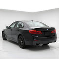 BMW_Series_5_g30_spoiler_2 duckbill spoiler lip
Black BMW car on a white background